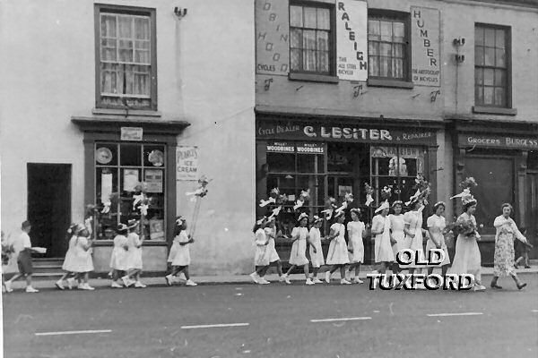 Procession in the Market Place in front of Lesiter's cycle shop