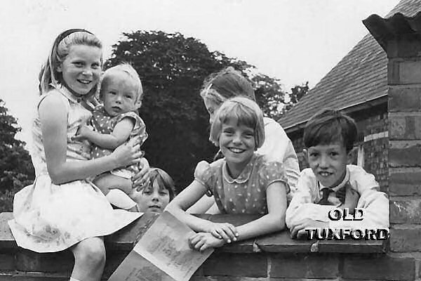 Children in the school playground - one clutching programme - 1966