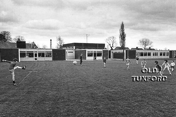 Boys playing football - 1970s