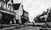 Looking up Eldon Street, old car, children playing