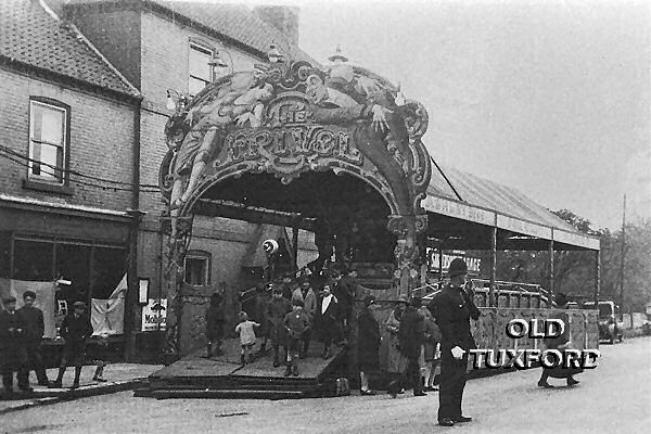 The Frivol - A fairground ride in front of Sanderson's Garage