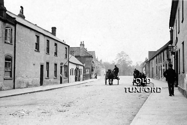 Looking down Newcastle Street from the Market Place, horse and carts